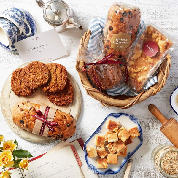 Baked gift hamper with fruit loaf, cookies and slice