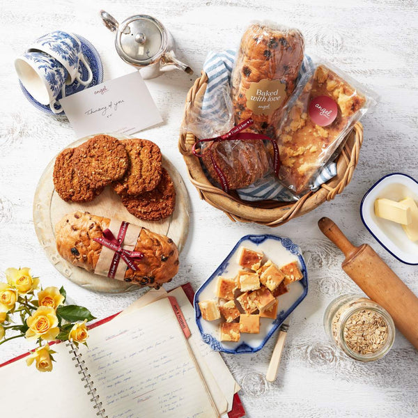 Baked gift hamper with fruit loaf, cookies and slice